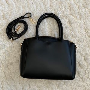 Black handbag, A New Day